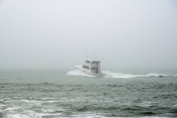 A luxury cabin cruiser sails out into the atlantic ocean into a fog bank on a late may morning.  I thought in terms of the world sailing into a COVID-19 environment, uncharted territory and riding blind.