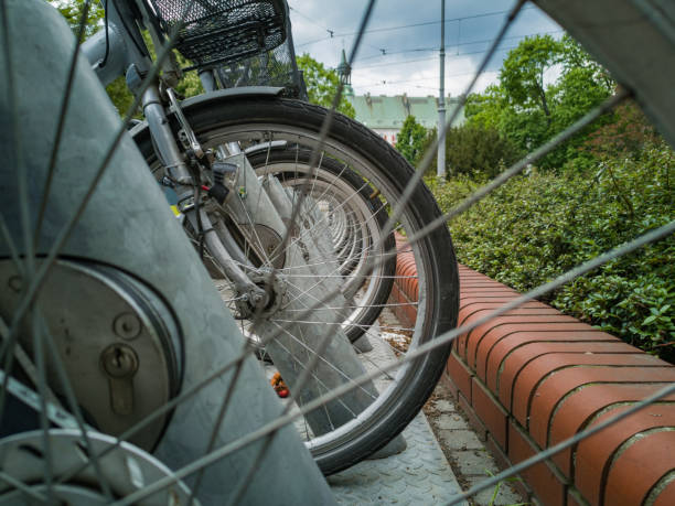 istock Bikes standing on bike station on sidewalk 1227594232