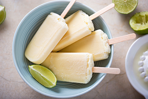 Lime and coconut popsicles stacked