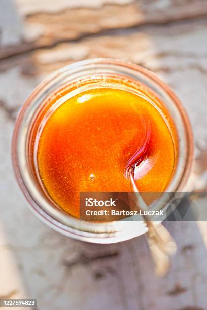 Manuka Honey In The Jar With Spoon Morning Sunlight Stock Photo - Download Image Now