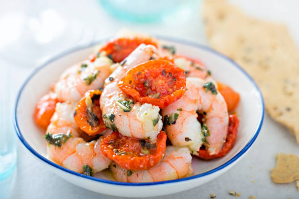 Kind prawns and semi dried cherry tomatoes with parsley dressing