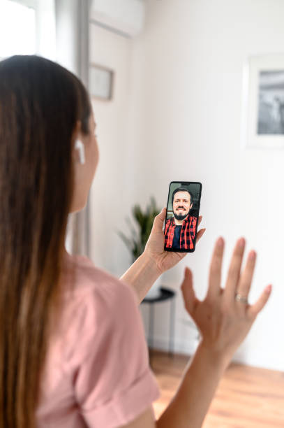 istock A young woman using phone for video call, zoom 1227596086