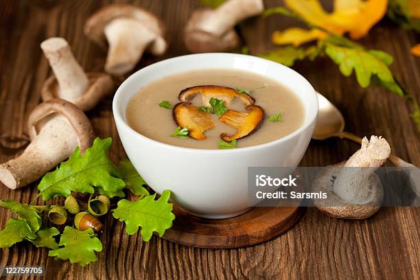 A White Bowl Of Mushroom Soup On A Wooden Counter Stock Photo - Download Image Now - Cream Soup, Edible Mushroom, Appetizer