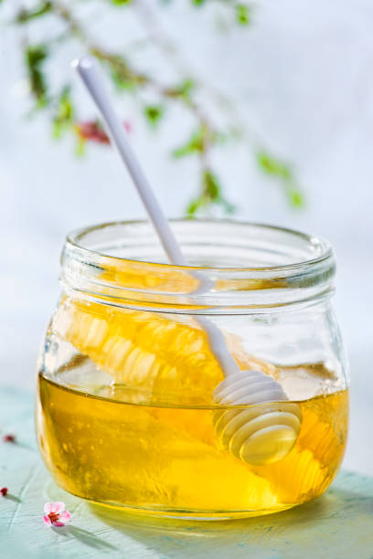 istock Honey with honey comb and honey dipper 1227597647