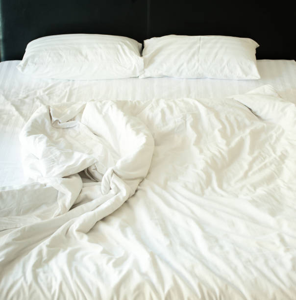 istock View of an unmade bed, Messy bed concep 1227599352