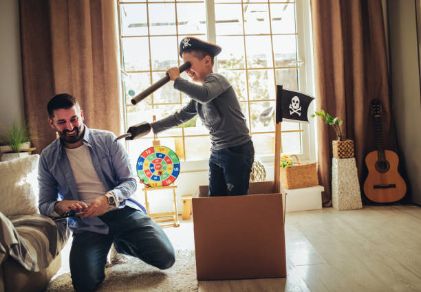 istock Father Playing Exciting Adventure  Game With Son 1227602734