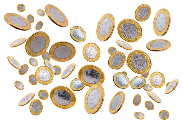 istock Falling one brazilian real coins isolated on white background 1227602976