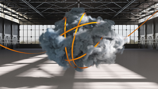 A wispy cloud trapped with a yellow ribbon in an industrial building