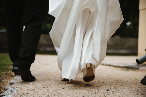 istock photo of a married couples feet walking 1227606311