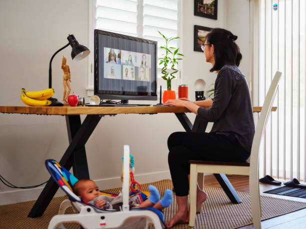 istock Young Mother Working From Home on a Video Conference Call 1227608552