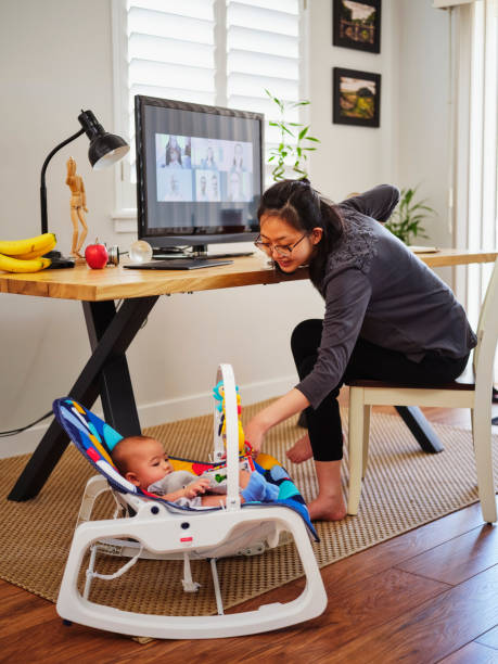 istock Young Mother Working From Home on a Video Conference Call 1227608565