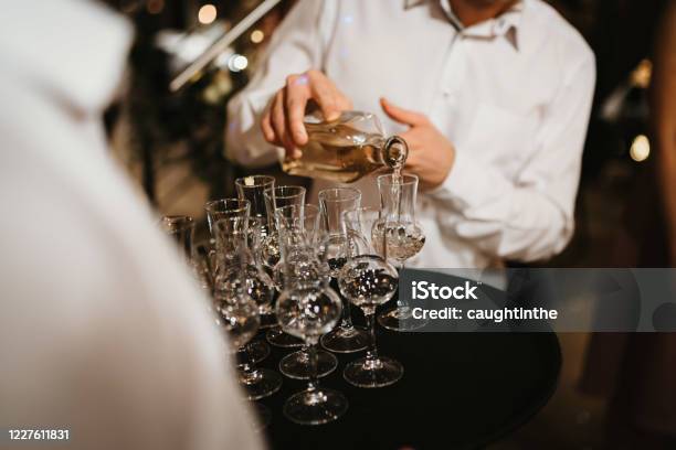 Photo Of A Waiter Seving Alcohol In Glasses Stock Photo - Download Image Now - Alcohol - Drink, Aperitif, Bakery