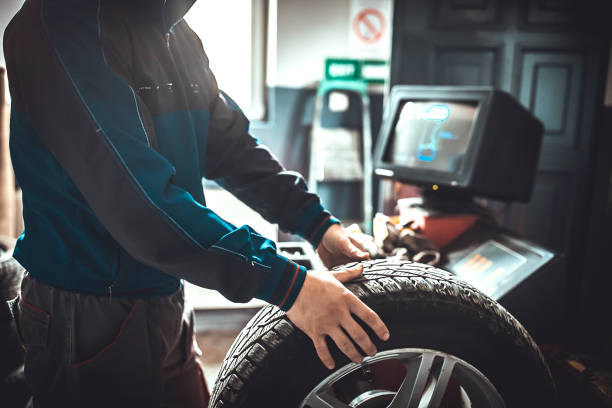 istock Male mechanic replacing wheel tire and balancing it 1227612351
