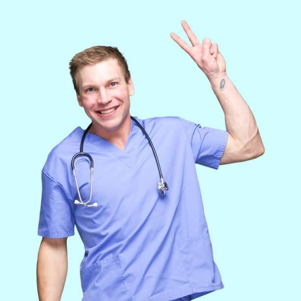 istock Caucasian male standing in front of colored background 1227612373