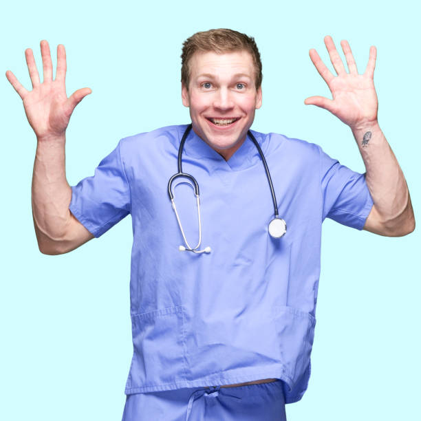 istock Caucasian male standing in front of colored background 1227612390