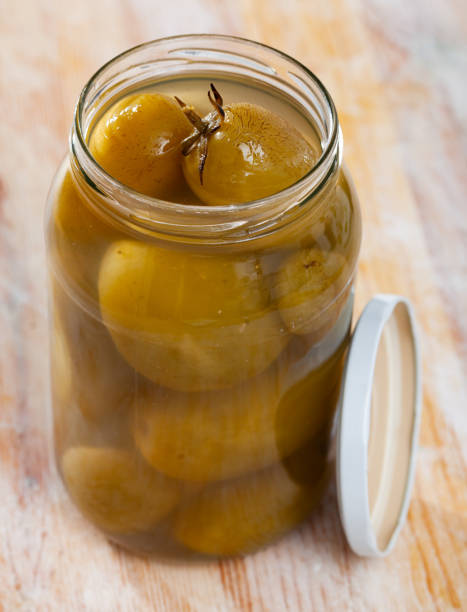 istock Delicious pickled barrel tomatoes on a plate 1227613920