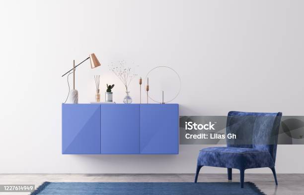 Interior Design Of Luxury Living Room With Stylish Armchair Blue Cabinet And Elegant Personal Accessories White Wall In Modern Home Decor Template Stock Photo Stock Photo - Download Image Now