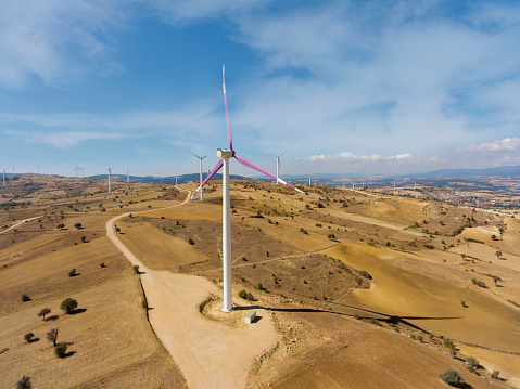 Alternative Energy Wind Turbine in Beautiful Yellow Landscape in Konya plateau.