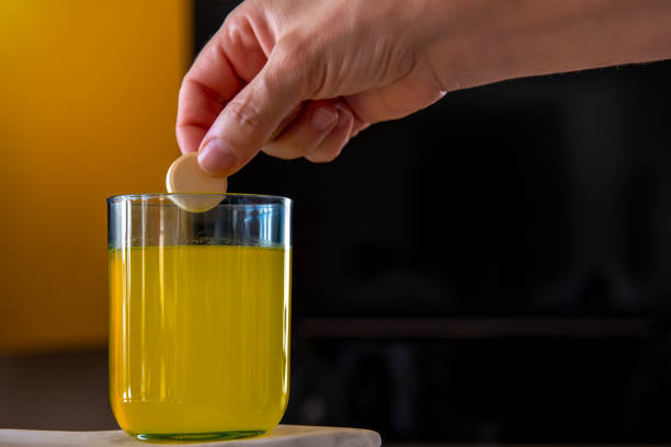 istock Woman throws effervescent tablet in water 1227620129