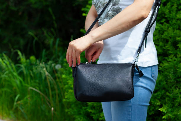istock woman open bag in street 1227620403