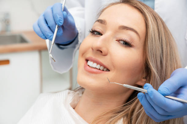 istock Woman having teeth examined at dentists 1227621719