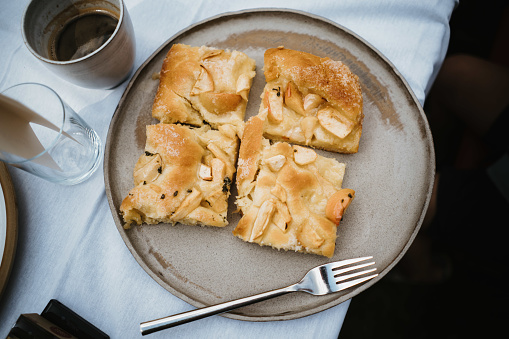 an apple pie pieces in a plate with a fork