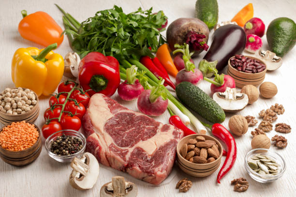 istock Raw Meat. Marbled beef steak with vegetables, beans, nuts 1227624954