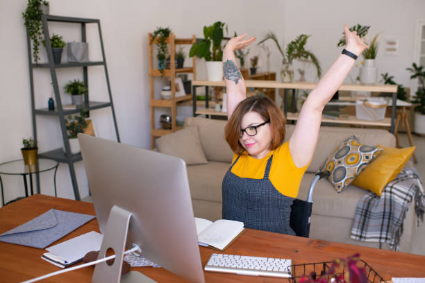 istock Stretching at home desk 1227627858
