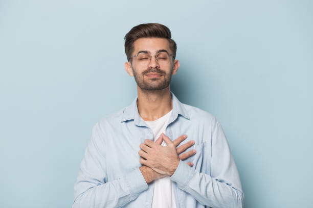 istock Happy thankful mindful young guy feeling hopeful. 1227629292