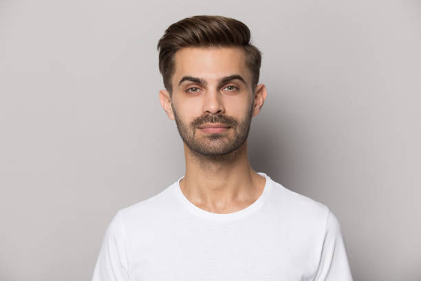 istock Millennial confident concentrated guy looking at camera portrait. 1227629315