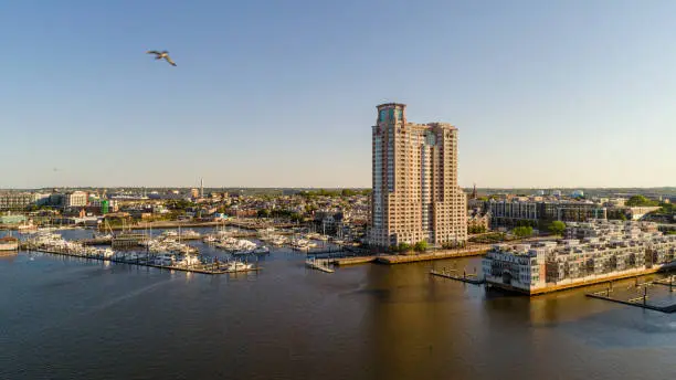 Photo of The aerial view on Harbor View residential district and marina at Patapsco River in Baltimore, Maryland, USA, at sunset.