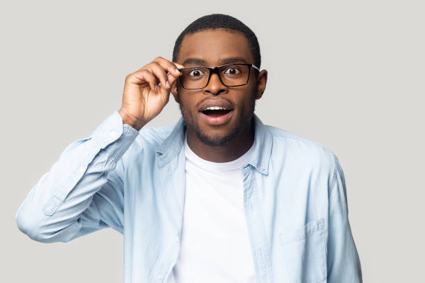 African guy staring at camera cant believe his eyes