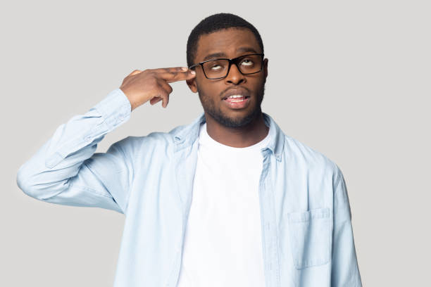 istock African guy put imaginary gun to head make killing himself 1227633025