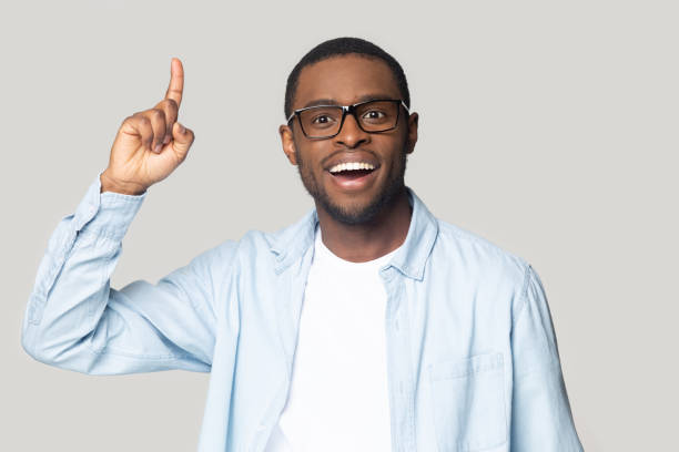 istock African guy raised index finger came up with great idea 1227633026