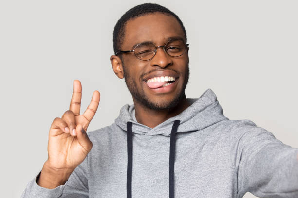 istock African guy takes selfie photo webcam view studio shot 1227633057