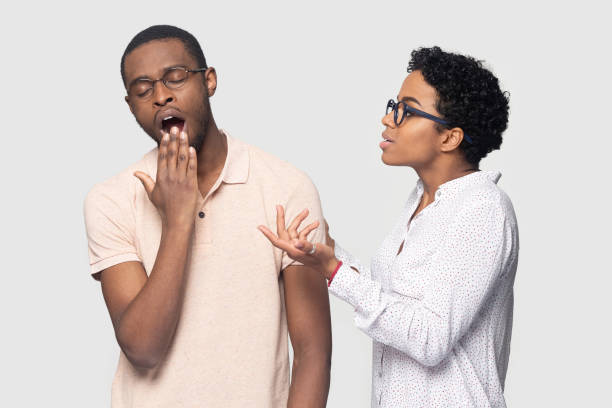 istock African wife nags husband express discontent while he yawning 1227633073