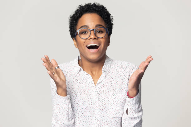 istock Woman raised hands open mouth scream with joy feeling happiness 1227633106