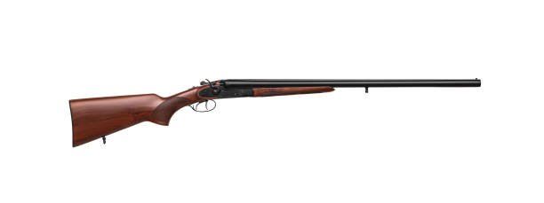 istock Classic double-barrell smooth-bore hunting rifle isolated on white background. Weapons for sport and hunting. Wooden butt gun. 1227633560