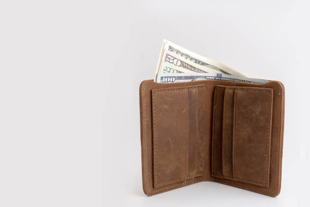 istock wallet with dollars sticking out of it 1227636074