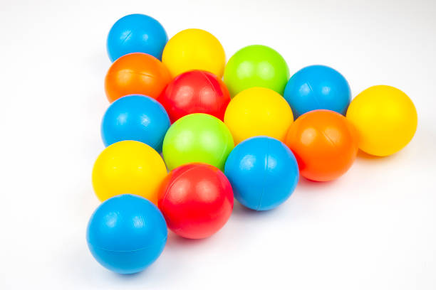 istock Colored plastic balls on white background. leisure and game items. round objects 1227638734