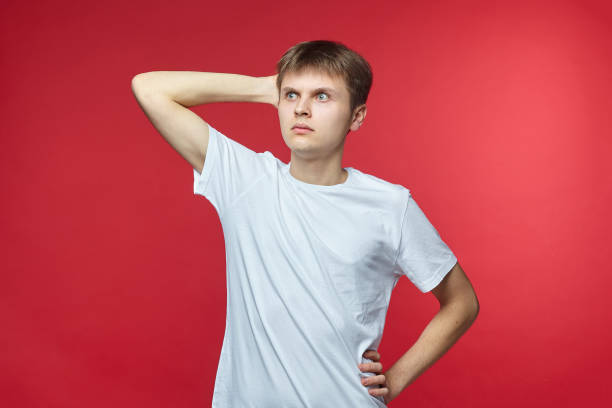 istock The young guy shows various emotions. Talented portrays the inner state and mood. Advertisement concept 1227638758