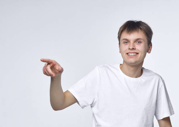 istock The young guy shows various emotions. Talented portrays the inner state and mood. Advertisement concept 1227638785