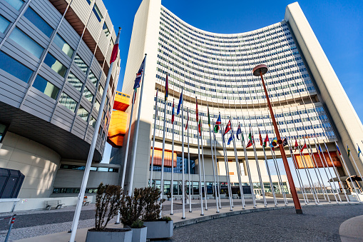 UN building in Vienna, Austria with flags on a sunny day against the sky. Horizontal orientation. High quality photo.