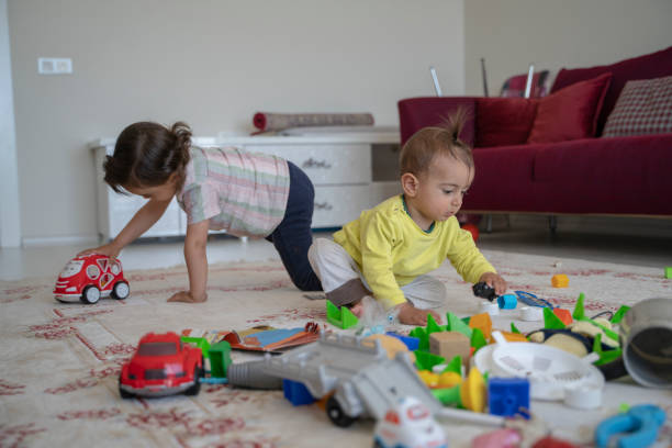 istock Two brothers playing with toys at home 1227641180