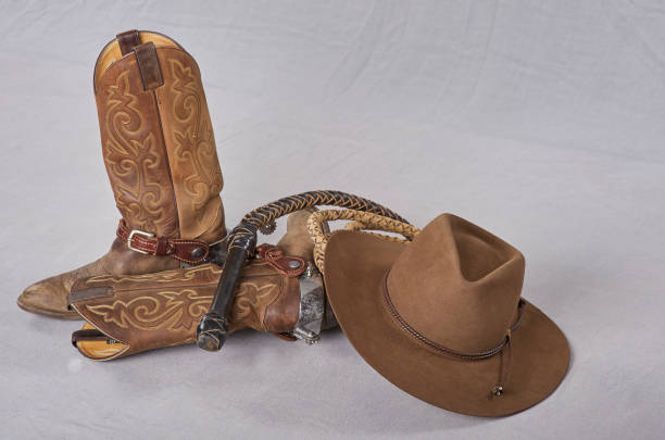 istock Cowboy boots, spurs, and somber 1227641302