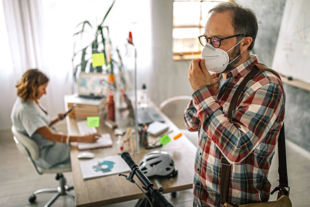 istock Businessman wearing face mask and leaving after work 1227645276