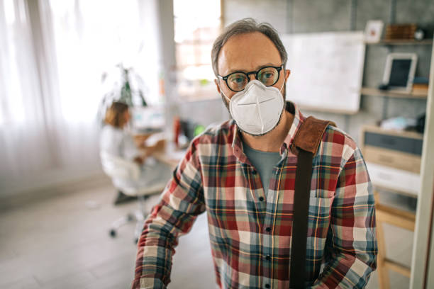 istock Businessman wearing face mask while leaving after work 1227645318