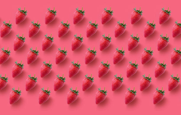 istock Colourful  seamless pattern made of red strawberries on red background 1227645685