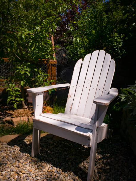 Relaxing seat in a city garden with apple trees