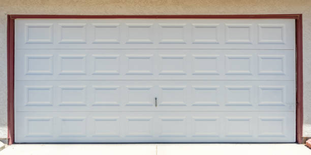 istock A white garage door installation on a suburban house 1227647704
